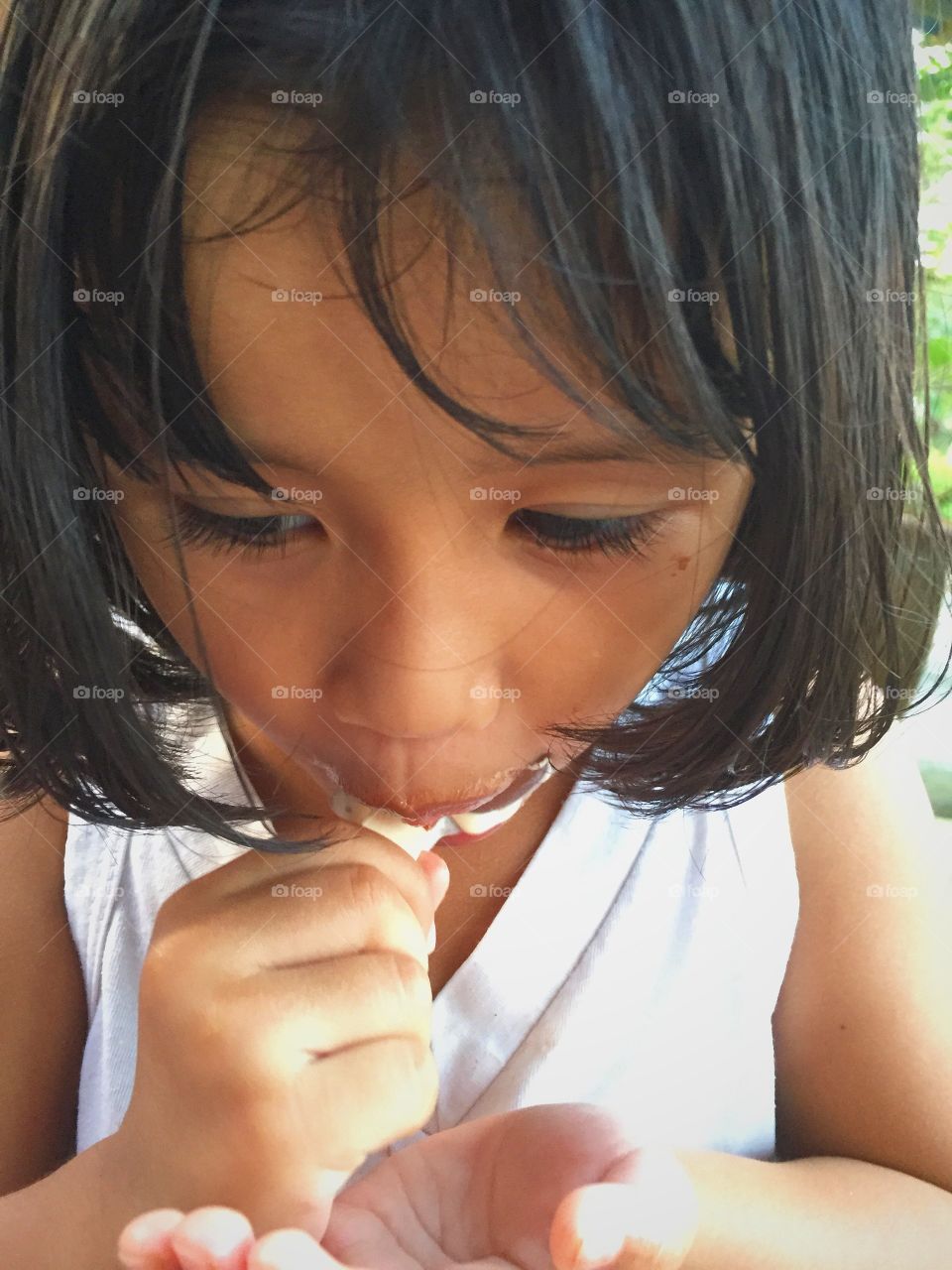 Close-up of a girl eating ice-cream