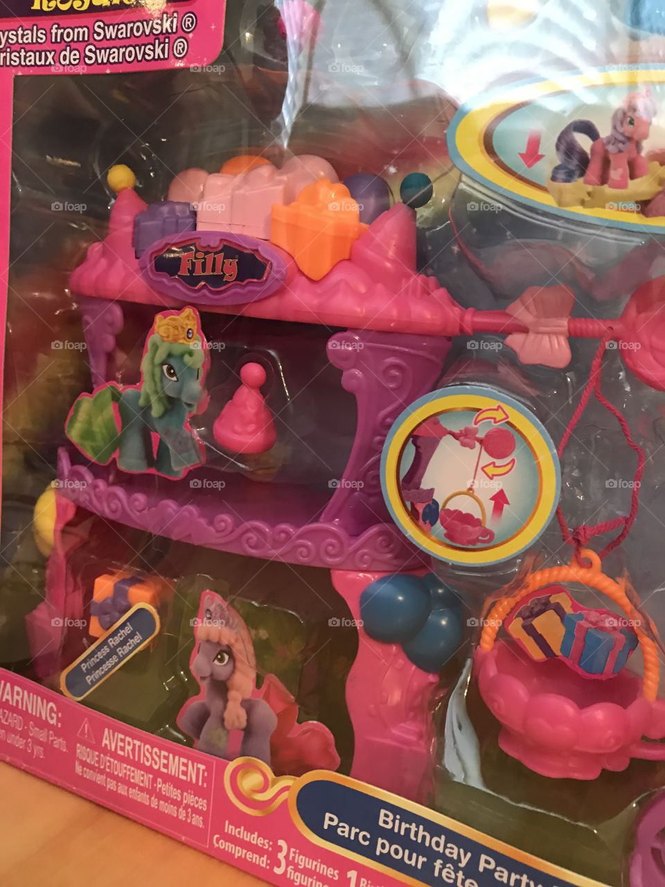 A closeup of a boxed Filly Royale playset, brightly colored