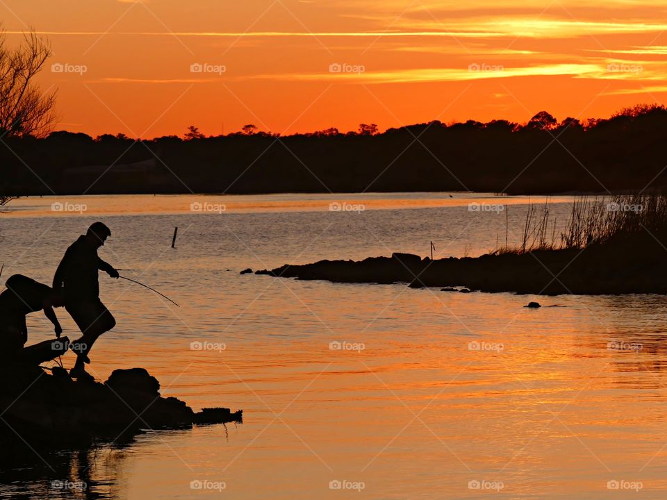 
Playing on the bay at sunset. The yellow ball of fire changed to hues of orange, yellow and then tangerine. It merged with the sky.