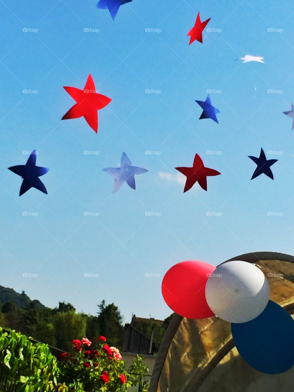 American colors at party. American stars and balloons fly in the clear sky at the party in my terrace