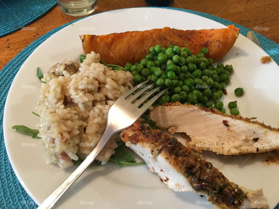 Mushroom risotto over arugula (rocket) and grilled chicken breast, with maple syrup glazed butternut  squash pumpkin, and minted peas sides