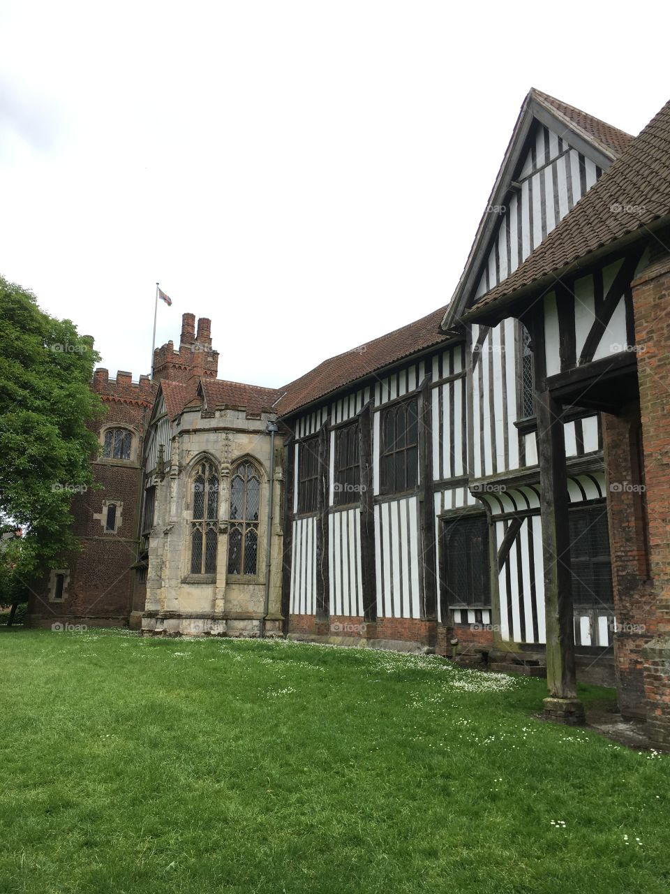 Exterior view of brickwork, timber framing and windows of the mediaeval Manor House of Gainsborough Old Hall in England