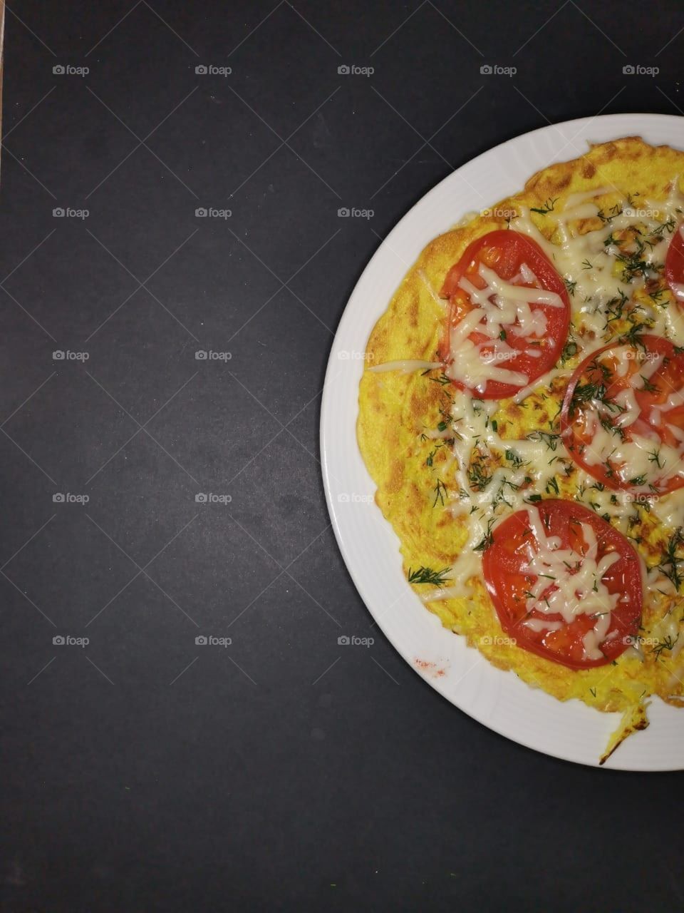 Half plate.  Omelet with tomatoes and cheese