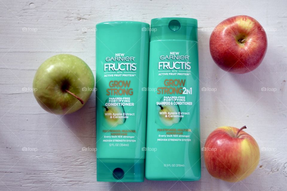 Garnier grow strong conditioner and shampoo Flat lay on a white background