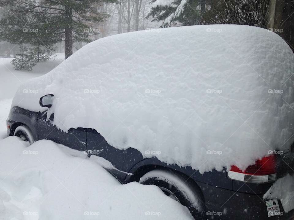 SUV under 2feet of snow