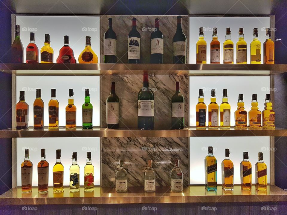 bar with light up shelves and bottles