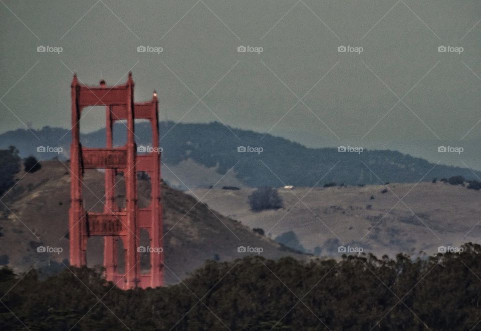 Golden Gate Bridge with background mountains