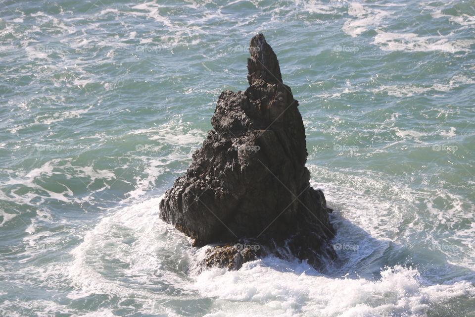 rock in the ocean
