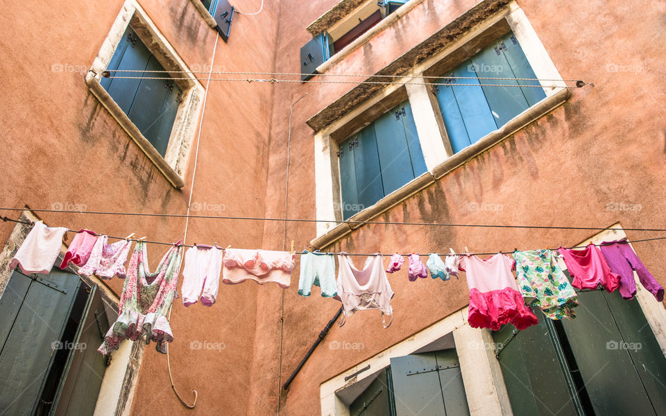 Windows And Hanging Laundry In Venice, Italy
