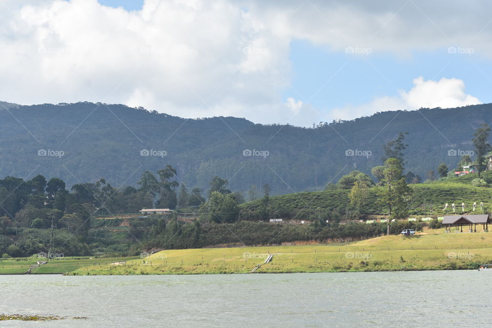 Gegories lake surrounded by mountains and greenary