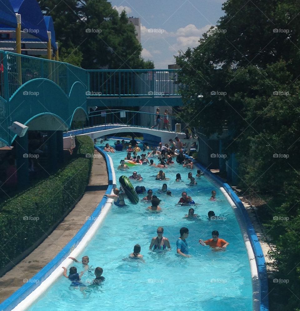 Lazy time. People in lazy river at hurricane harbor