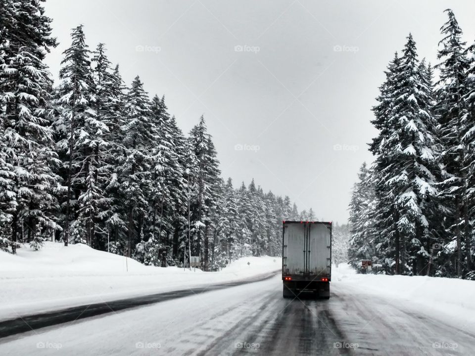 Semi Truck in Snow ice Storm Mount Hood mountains Oregon