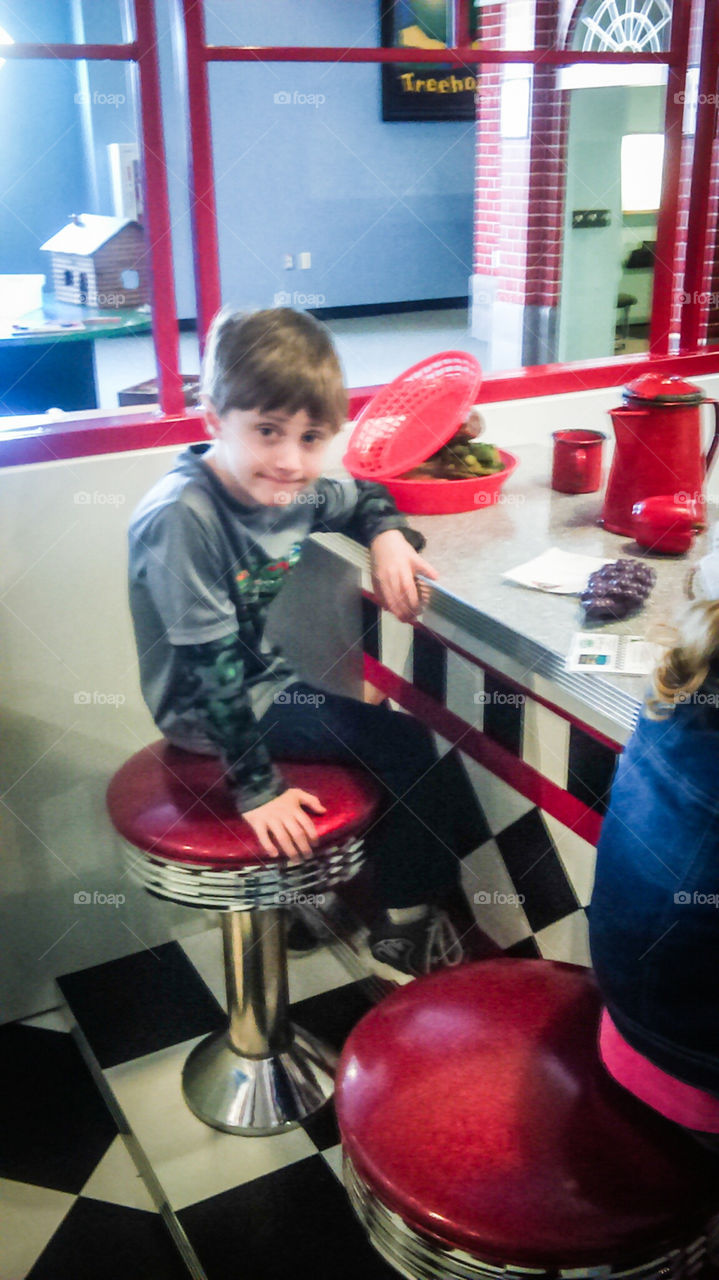 boy sitting at dinner