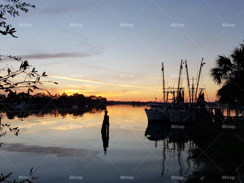 Florida oyster fishing boats moored at sunset