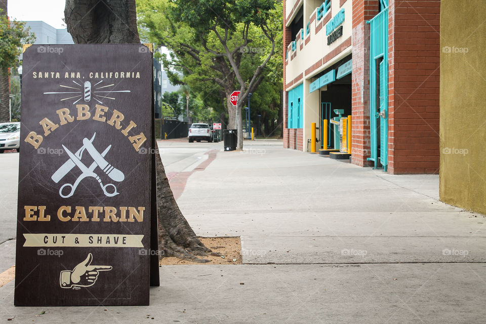 Sign In Front Of Barberia El Catrin Located In Santa Ana, California