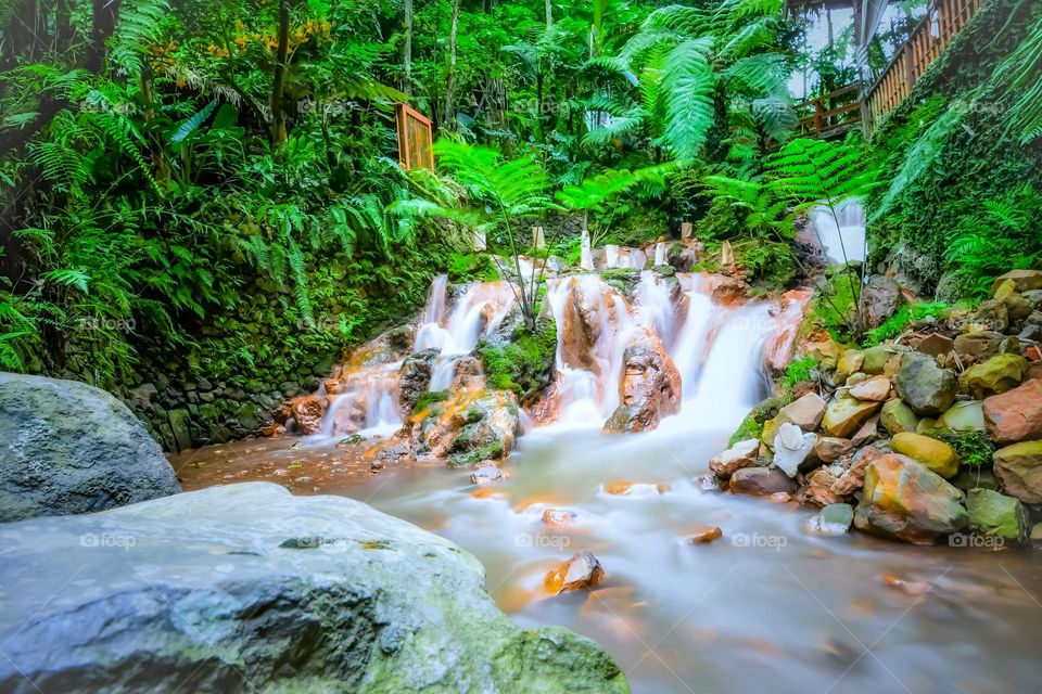 long exposure small waterfall in a beautiful garden in Bali, Indonesia