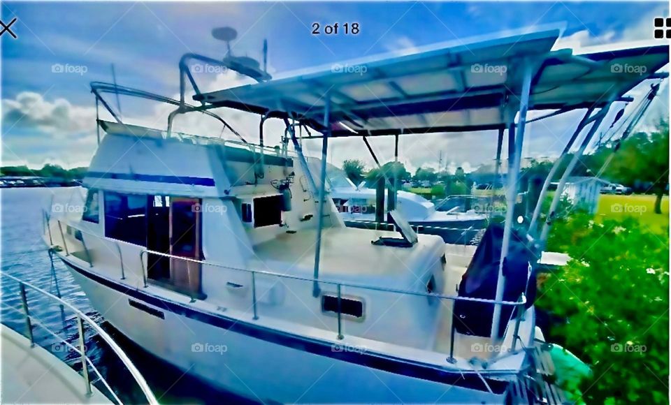 A.beautiful brand new fiberglass boat in the waters of the East River In Sheepshead Bay, Brooklyn, NY photographed in late 2020. Hypnotic Productions