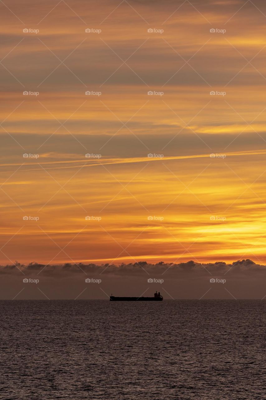 Ferry sails in the Baltic Sea at dawn