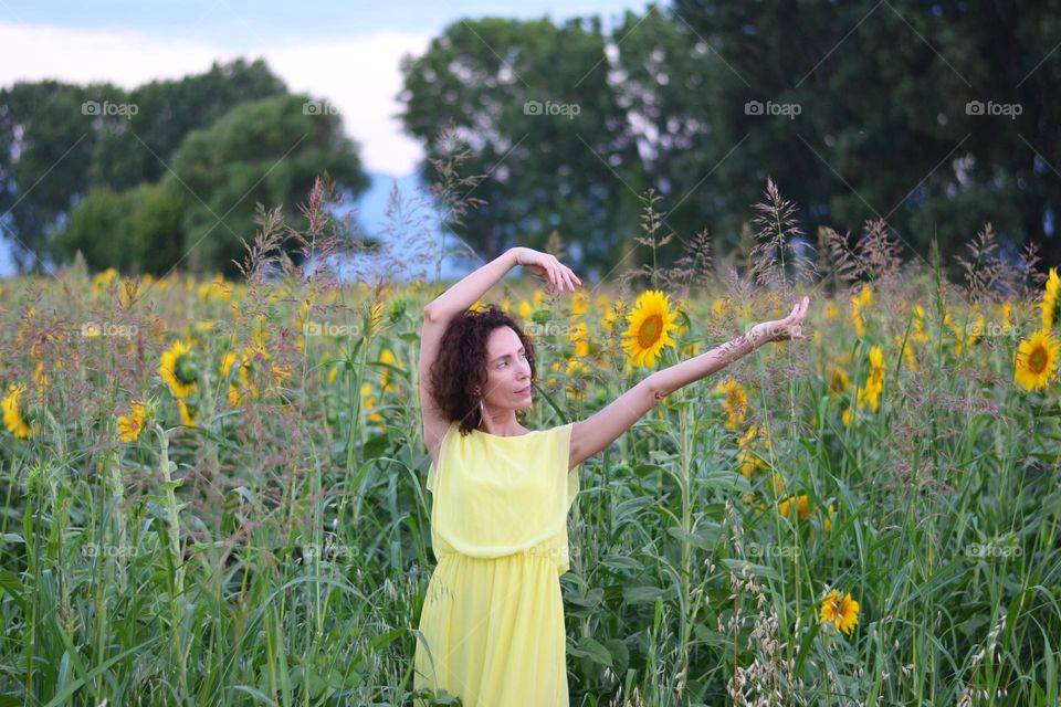 Beautiful Young Woman Dancing Outside in Nature