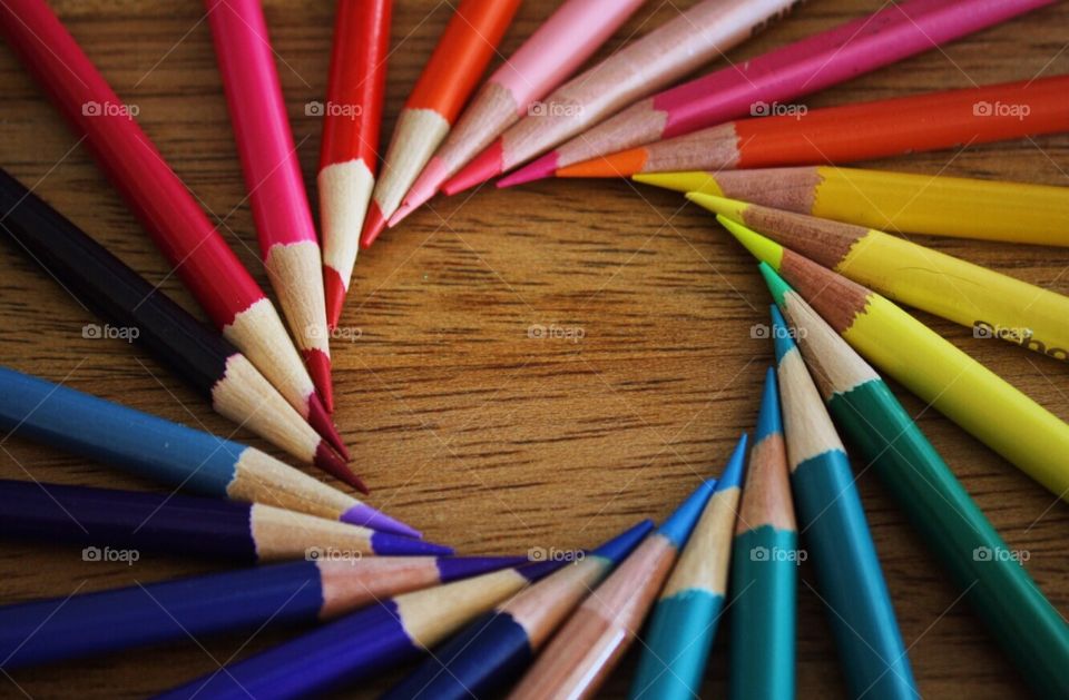 Colorful pencil on wooden table