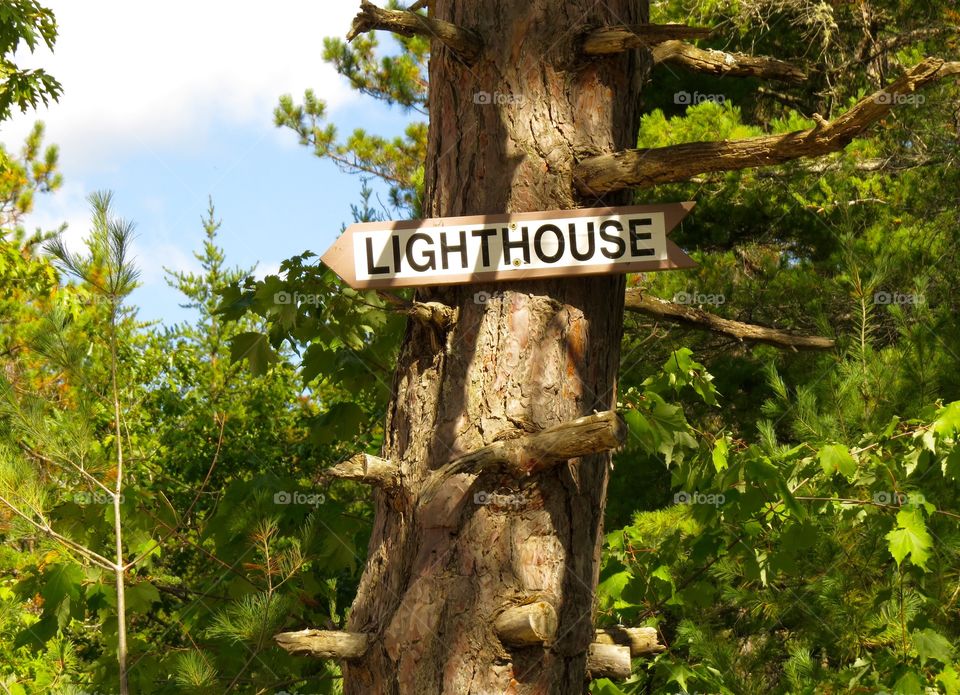 Lighthouse sign. Sign pointing the way to Crisp Point Lighthouse, MI