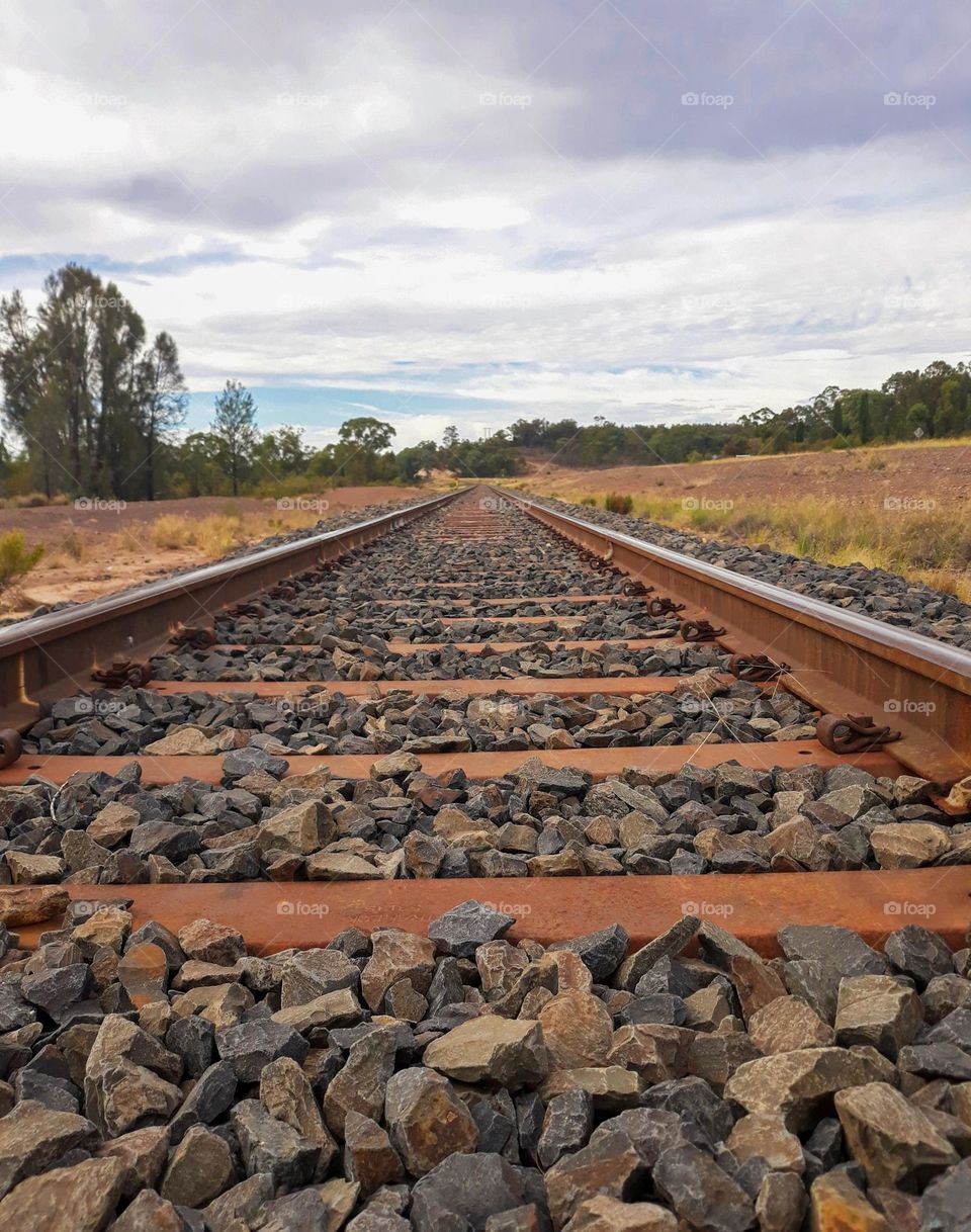 From the ground looking up lying on a country railway track looking up photograph taken at mendoran NSW Australia