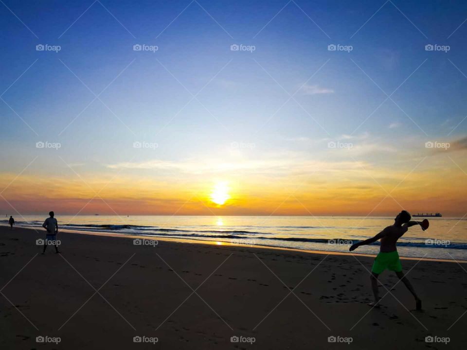 happy summer holiday relaxing on the beach with beautiful sunset