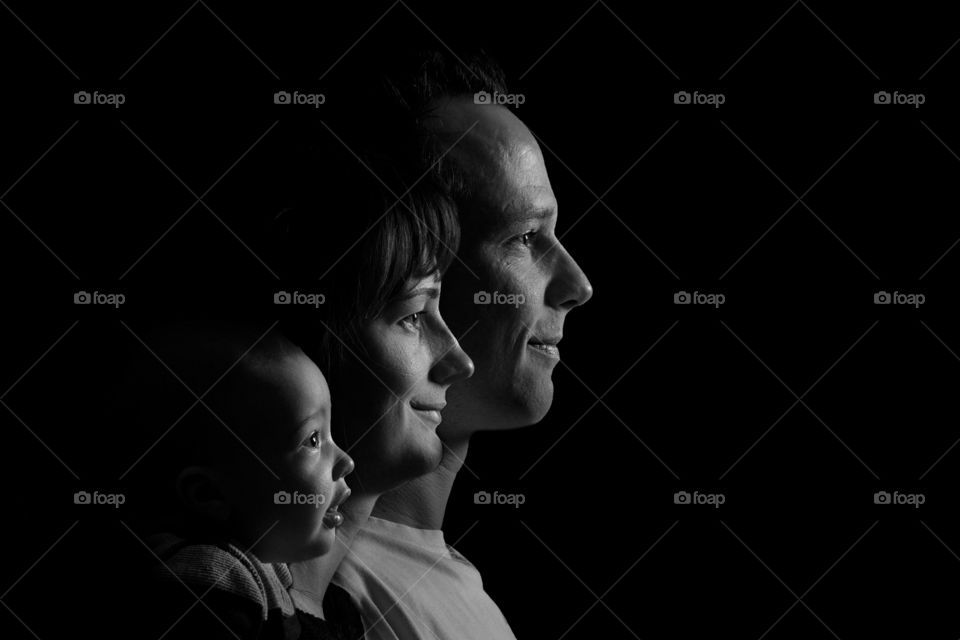 Happy family in black background