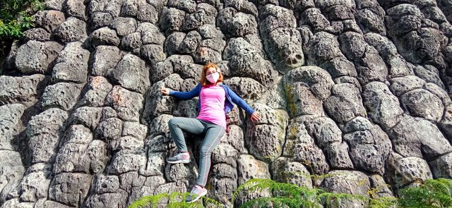 under an ancient lava waterfall.