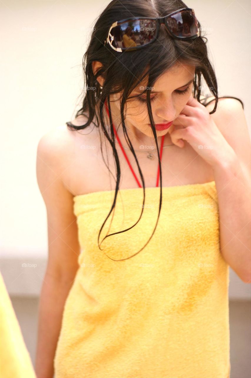 portrait of a pretty girl in a yellow towel