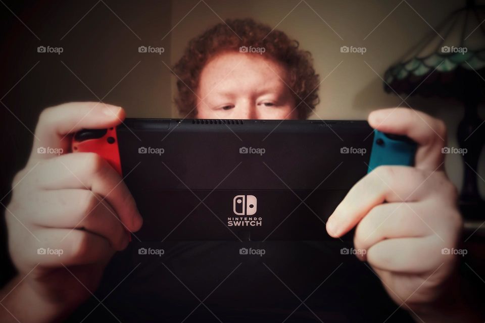 Man Playing Video Game on a Switch