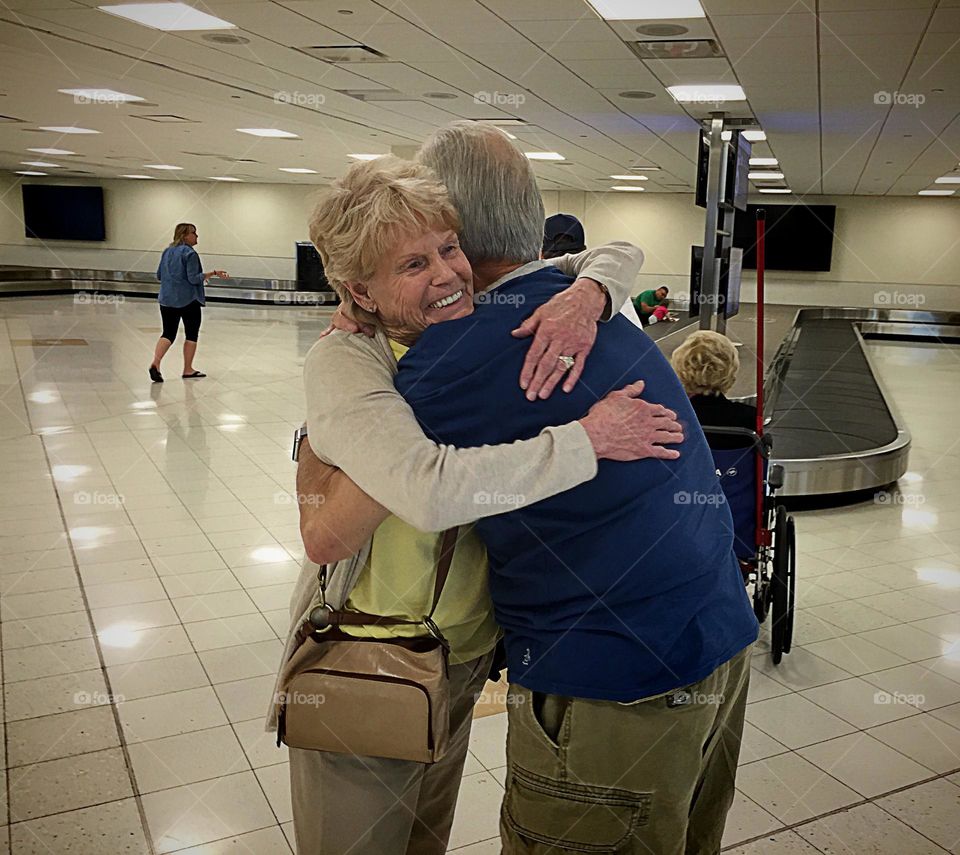 Loving embrace at an airport reunion.