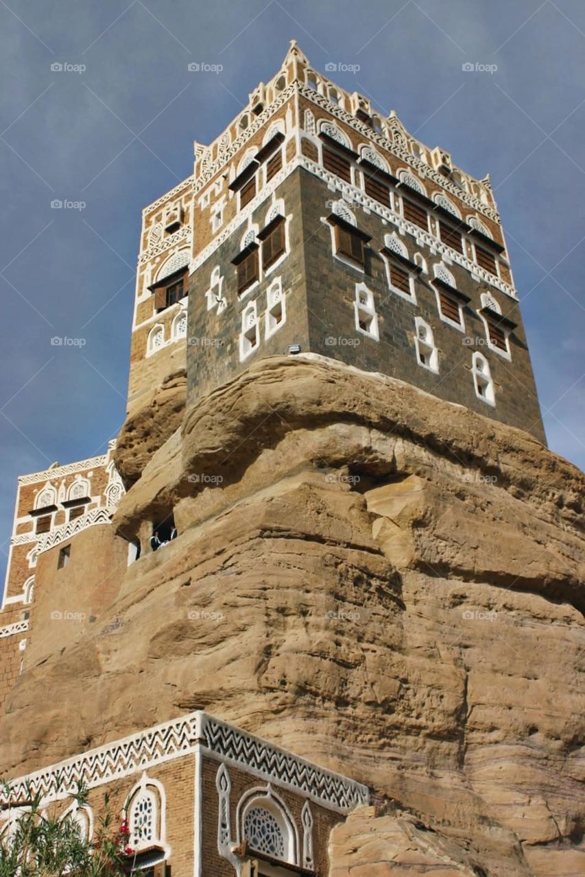 A stunning view of green mountains covered in fog in Yemen