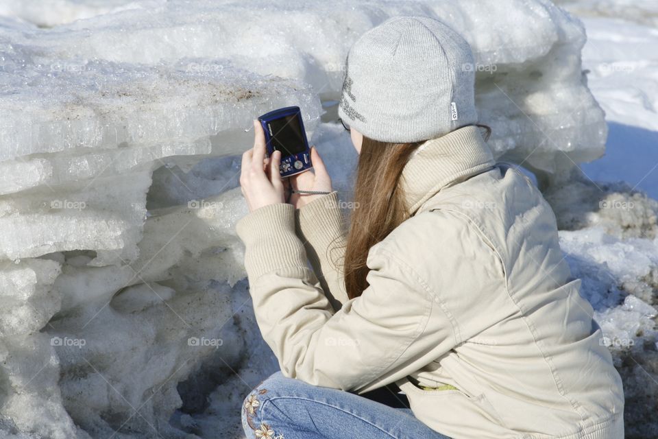 Girl taking pictures. Winter 