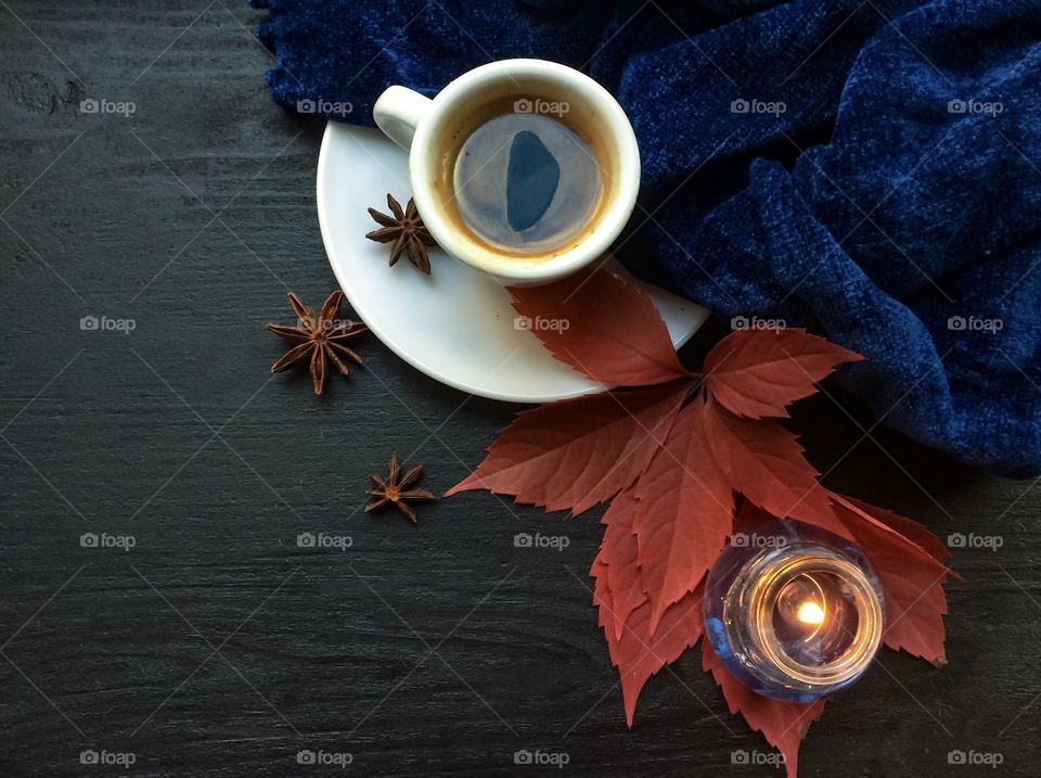 Cup of tea with autumn leaves