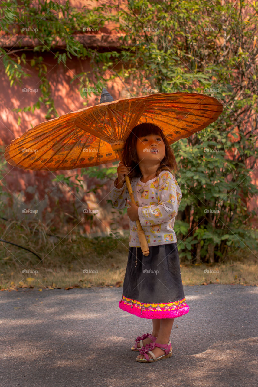 Asian girl holding parasol