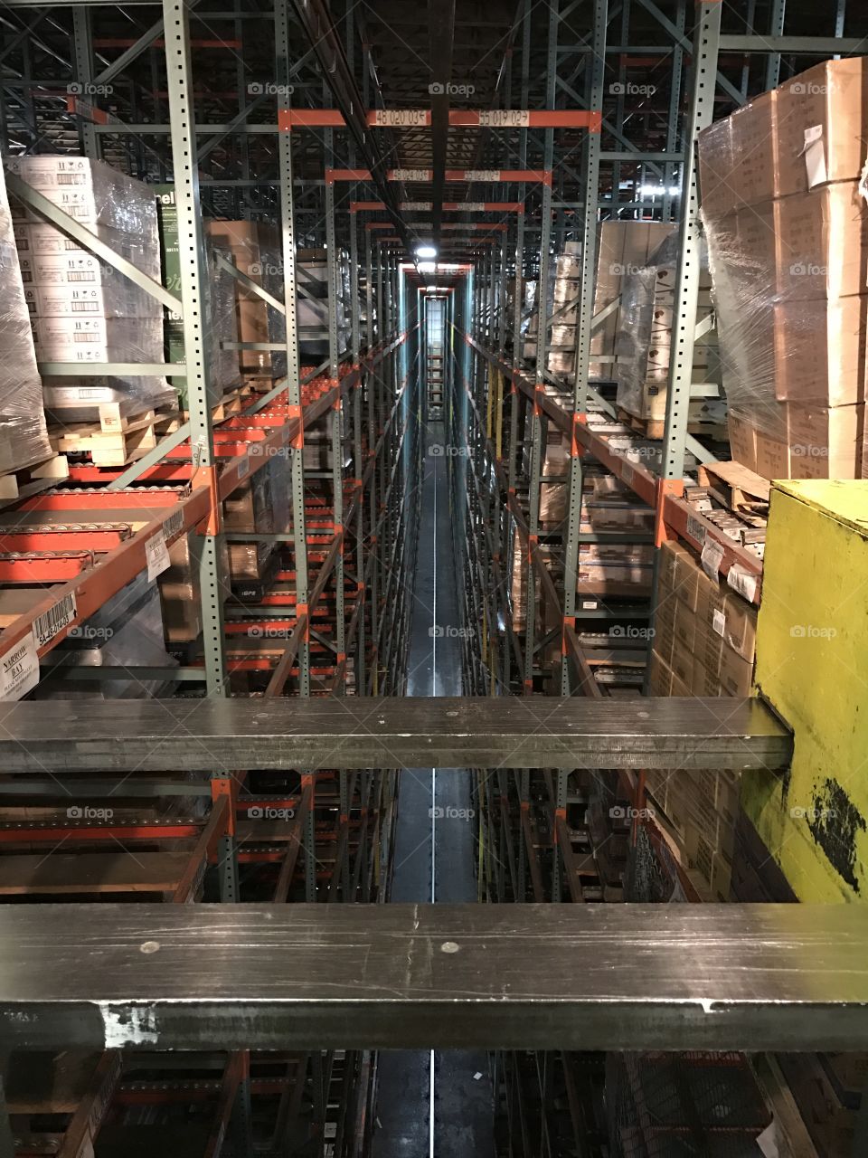Crane operator in dirty warehouse.