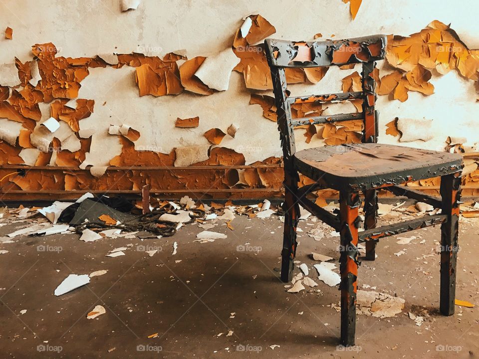 Old wooden chair in weathered house