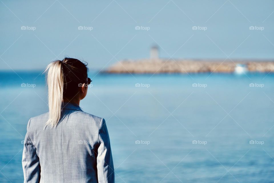 Woman looking at the lighthouse
