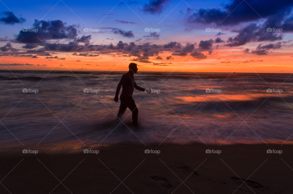 Walking through the beach.