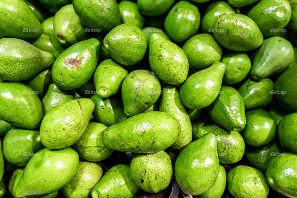 Fresh organic tropical avocado fruit on local market, Bali.