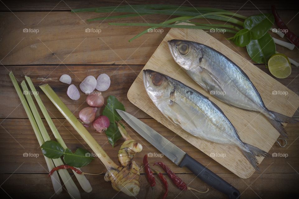 Mackerel with spices ingredient ready to cook on wooden, thai food, food flat ray