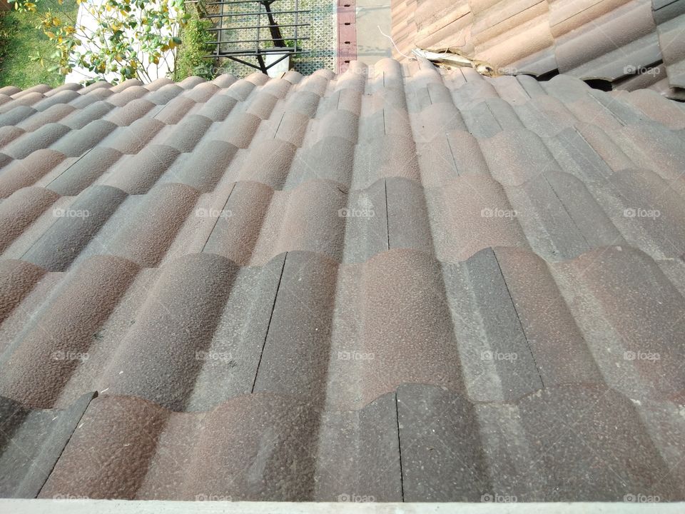 Close up of roof tiles that have been used for a long time.