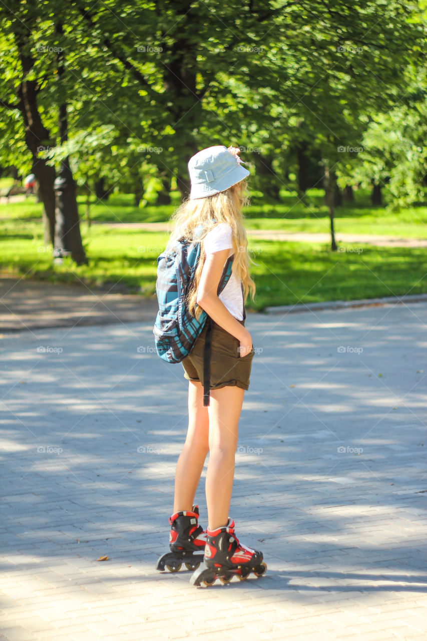 Girl rides on roller skates