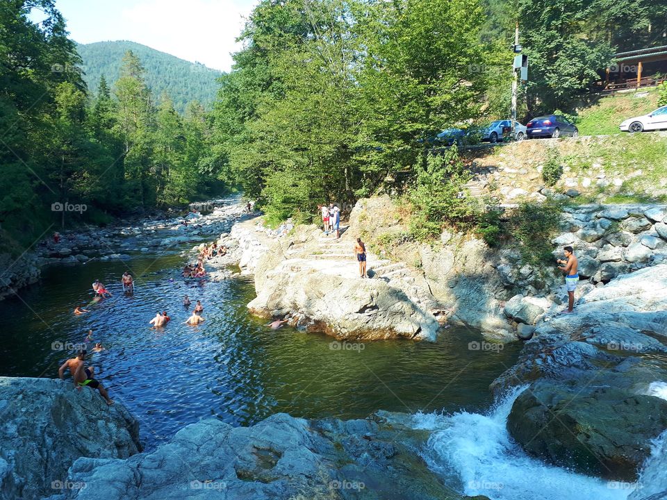 rest and recreation in nature on the river and waterfall Kamenica