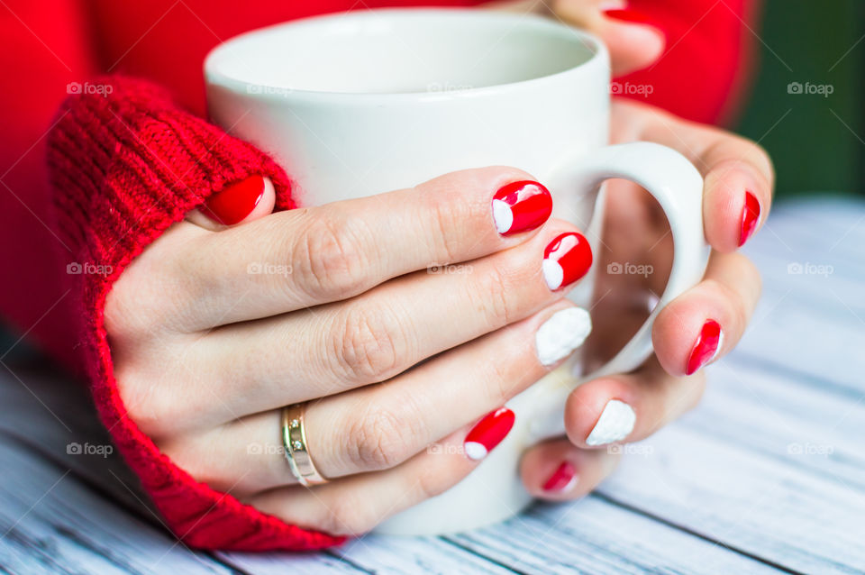 woman hand with cup of tea