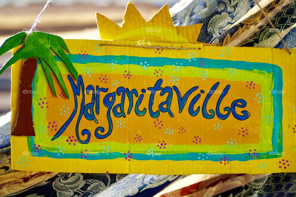 Party sign Margaritaville in yellow blue and orange