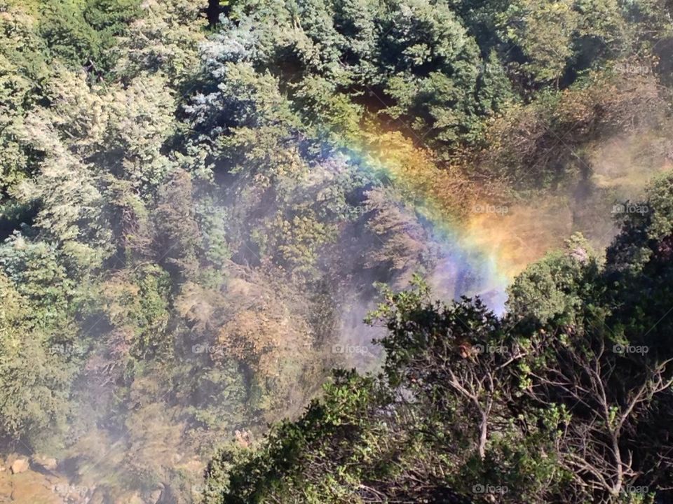 Rainbow over waterfall