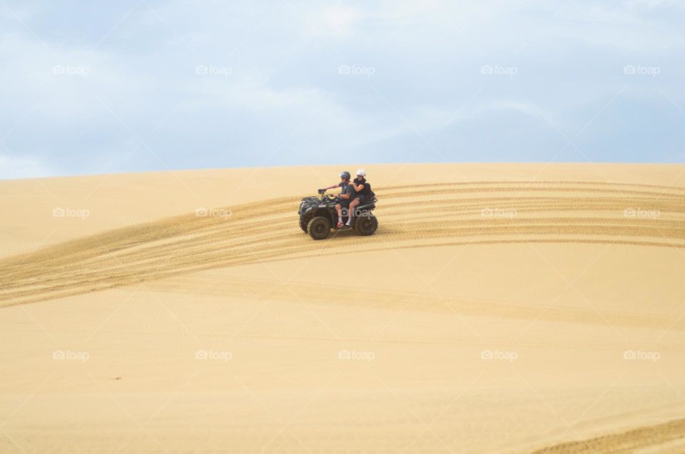 Quad biking on sand dunes