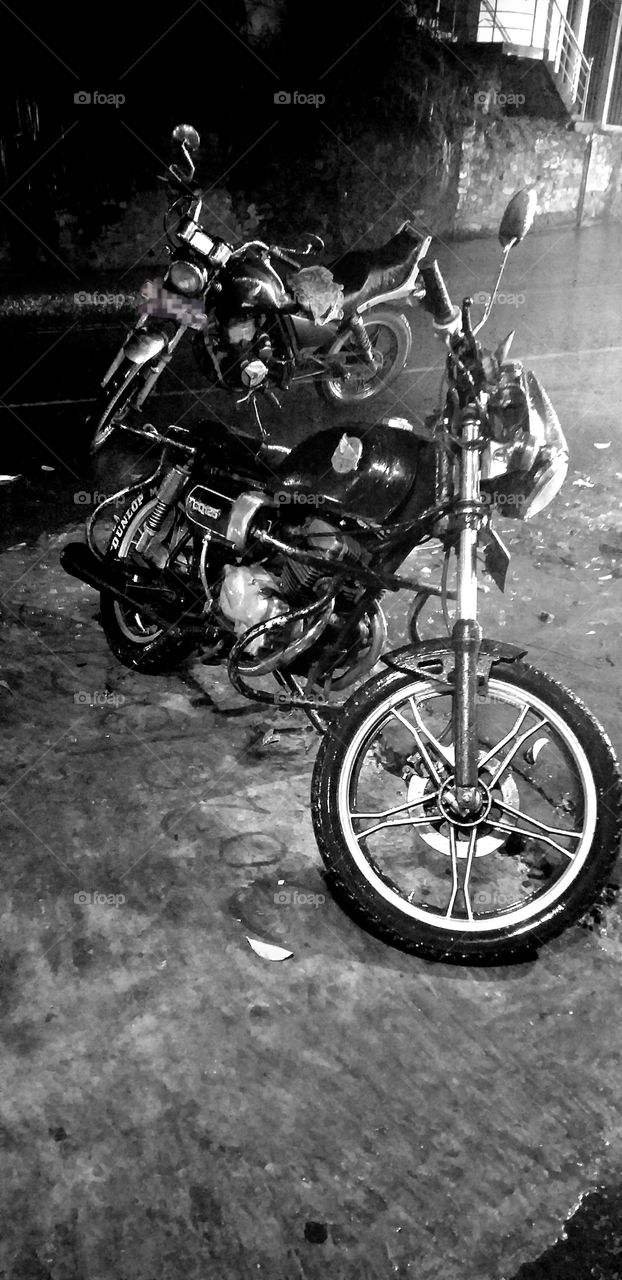 beautiful classic motorbikes in heavy rain